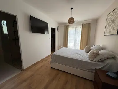 a living room with a table and chairs and a couch at La Villa Solena in Ferrals-lès-Corbières