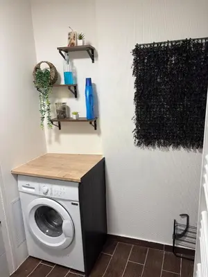 a laundry room with a washer and dryer at Apartamento carccassone in Carcassonne
