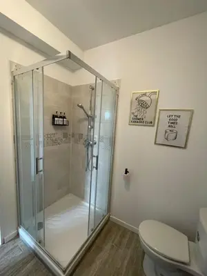 a bathroom with a shower and a toilet at Les Halles d'Isa et Thomas in Narbonne