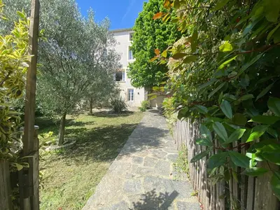 a path in front of a house with a fence at Maison de maître avec piscine et vue in Villardonnel