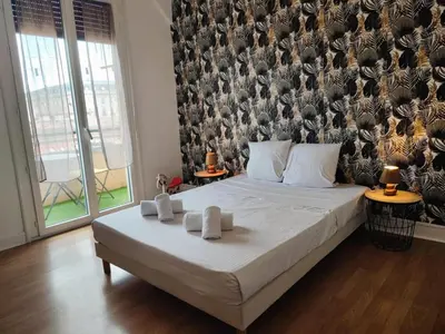 a bedroom with a bed with two towels on it at Casa Mistral in Carcassonne