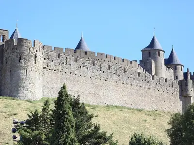 a large castle on top of a hill at Maison Bacou cité 1 in Carcassonne