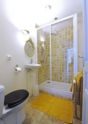 a bathroom with a shower and a toilet and a sink at Carcassonne Town House, Rue Barbès in Carcassonne