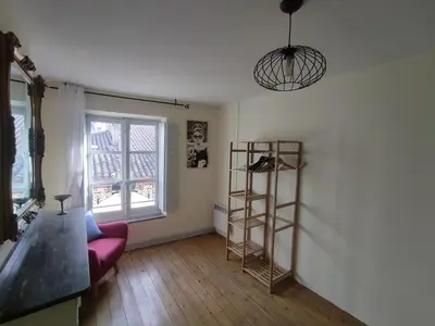 a living room with a ladder and a shelf at Carcassonne Town House, Rue Barbès in Carcassonne