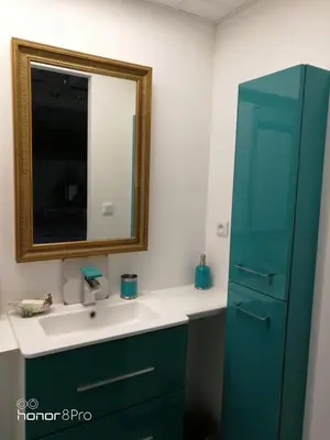 a bathroom with a sink and a mirror at la cassignolette in Castelnaudary