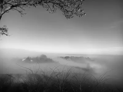 a black and white photo of a foggy field at la cassignolette in Castelnaudary
