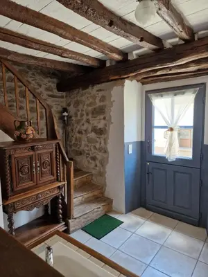 a room with a blue door and a window at Le Vieux Fusil in La Celle-sous-Gouzon