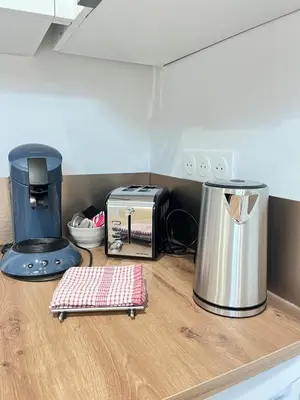 a counter top with a toaster at La Suite Lauragaise - Studio climatisé in Villefranche-de-Lauragais