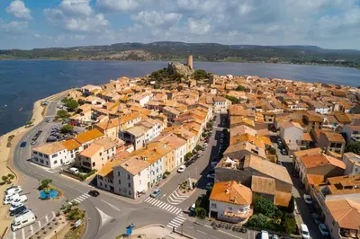 an aerial view of a town next to the water at Alcôve Marine in Gruissan
