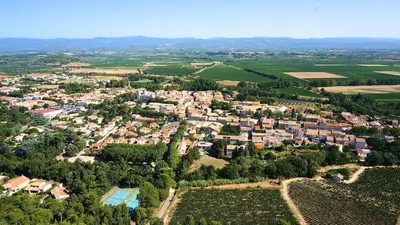 an aerial view of a city with houses and trees at Chez Nous, Chez Vous ! in La Redorte