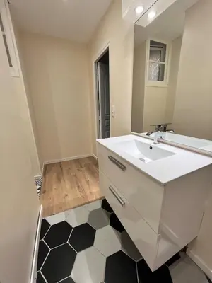 a bathroom with a white sink and a mirror at Quiet house for 12 people near Cité Carcassonne in Carcassonne