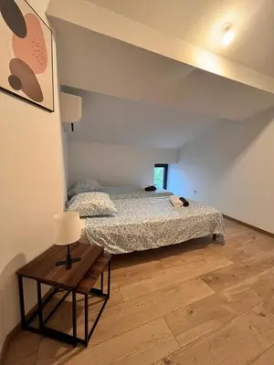 a bedroom with a bed and a table at Quiet house for 12 people near Cité Carcassonne in Carcassonne