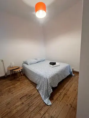a bedroom with a bed with a blanket on it at Quiet house for 12 people near Cité Carcassonne in Carcassonne