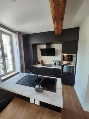 a kitchen with a sink and a stove top oven at Grand T4 lumineux 200 m du port in Castelnaudary