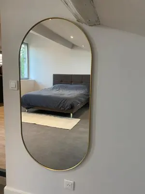 a mirror reflecting a bed in a bedroom at Superbe Appartement Atypique Combles - Neuf avec Vue in Narbonne
