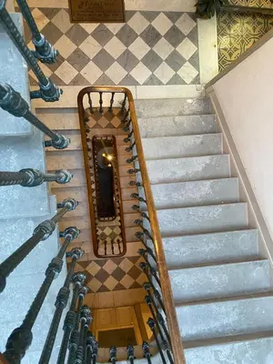 an overhead view of a spiral staircase in a building at Superbe Appartement Atypique Combles - Neuf avec Vue in Narbonne