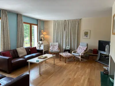 a living room with a couch and a table at Vacation home with pool in Quillan