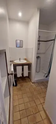 a bathroom with a sink and a shower at Gîte de L'estiu in Cascastel-des-Corbières