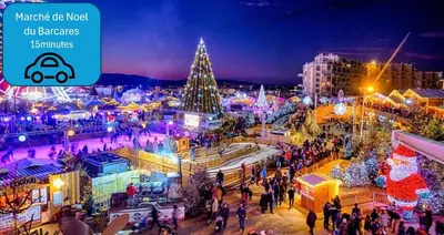 a group of people walking around a city with a christmas tree at Sejour plage Port-la-Nouvelle in Port-la-Nouvelle