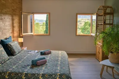 a bedroom with a bed with two pillows on it at BB Villa Sainte Marie in Limoux