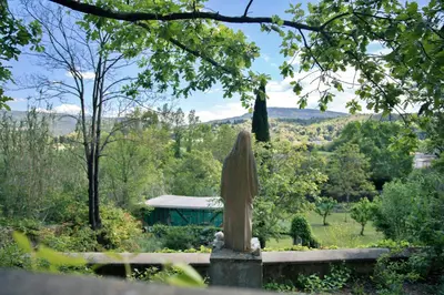 a statue in the middle of a garden at BB Villa Sainte Marie in Limoux