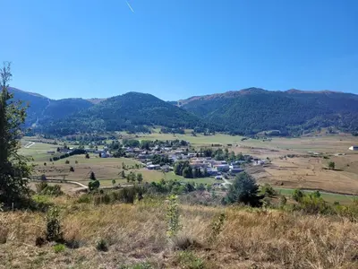 a view of a small town in the mountains at La Maison de Léonie in Camurac