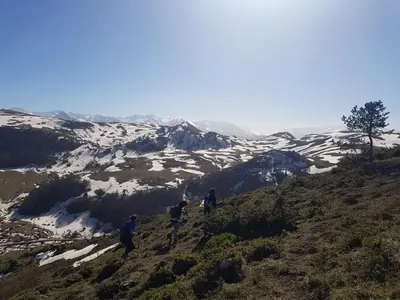 a group of people walking on a snow covered mountain at La Maison de Léonie in Camurac