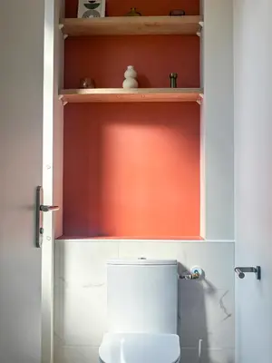 a kitchen with stainless steel appliances and a table at Le Goya, parenthèse artistique in Castres