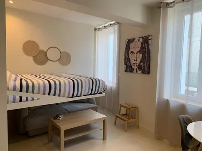 a bedroom with a bunk bed in a room at Studio Gili Meno in Narbonne