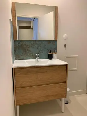 a bathroom with a sink and a mirror at Studio Gili Meno in Narbonne