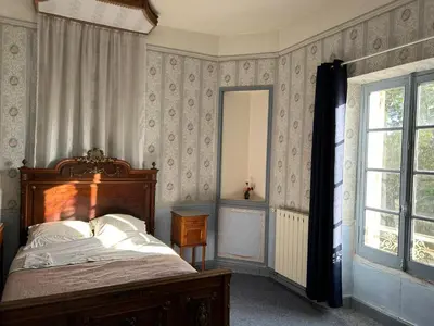 a bedroom with a bed and a window at Château Belle au Bois Dormant in Cambounet-sur-le-Sor
