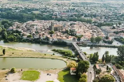 an aerial view of a city with a river at Maison accueillante à Trèbes avec 2 chambres in Trèbes