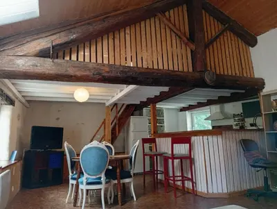 a dining room with a table and chairs in a room at Appartement prémian in Prémian