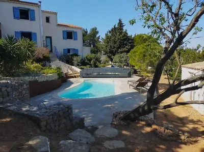a swimming pool in a villa with a house at De l'étang de BAGES au massif de la Clape in Narbonne