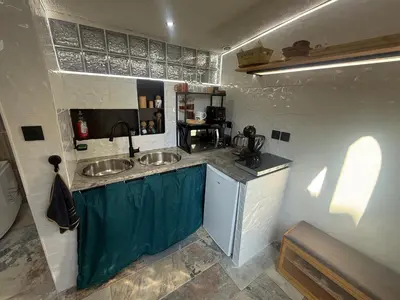 a kitchen with two sinks in a room at Tanabata logde in Pezens