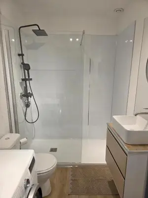 a bathroom with a shower and a toilet and a sink at Studio hypercentre in Castelnaudary