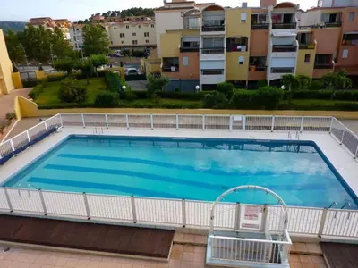 a large swimming pool on top of a building at Gruissan appartement Haut Standing in Gruissan