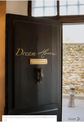 a bedroom with a bed with a floral mural on the wall at Dreamhome B&B Limoux in Limoux