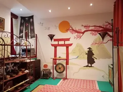 a room with a wall with a painting of a tree at Chambre d hôtes Cap instant in Capestang