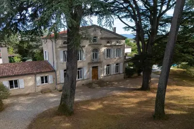an old house with trees in front of it at Villa Corbière - Piscine Privée in Castres