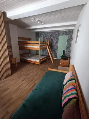 a bedroom with a bed and a bunk bed in it at Maison entière Les Maisons de Gaia in Tuchan