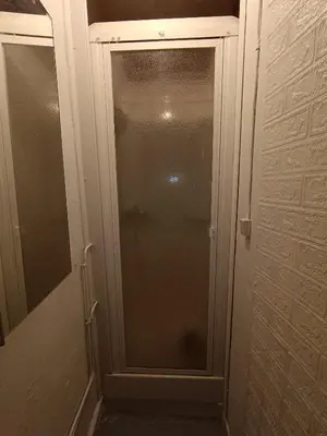 a glass door to a shower in a bathroom at Maison entière Les Maisons de Gaia in Tuchan