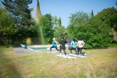 a group of people standing on surfboards in a field at Villa à Castres, Maison 10 personnes avec piscine privée, jardin et 5 chambres in Castres