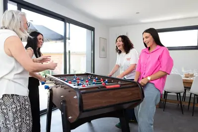 a group of women standing around a table with avertisementvertisementosateosateosateosate at Villa à Castres, Maison 10 personnes avec piscine privée, jardin et 5 chambres in Castres