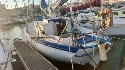 a boat docked in a marina with other boats at AMADONNe in Gruissan
