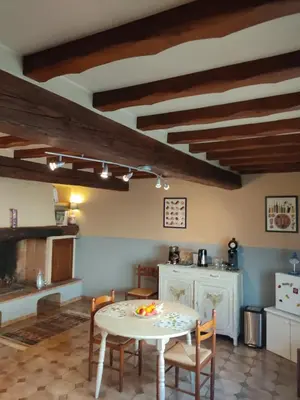 a kitchen with a table and chairs in a room at Zen à Mazamet in Mazamet