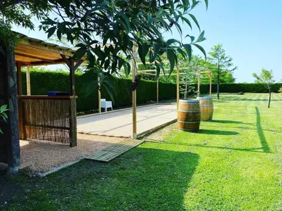 a swimming pool with two chairs and a house at Villa 39 - Ariège in Le Vernet