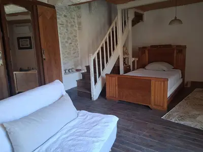 a bedroom with a bed and a stair case at - Atelier - in Villalier