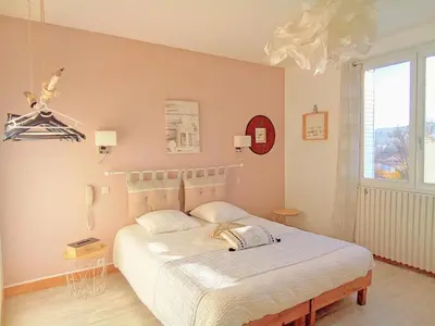 a bedroom with a large white bed in it at Le Mauzac chambre Zen in Limoux