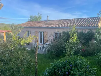 a small house with a garden in front of it at Villa avec piscine à mirepoix in Mirepoix